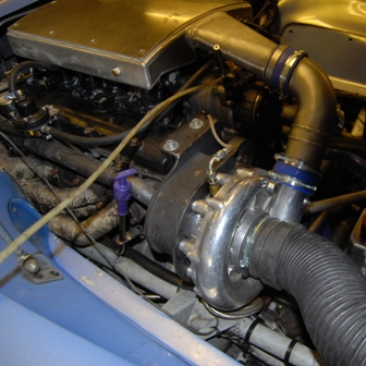 Basically a mechanically driven turbo compressor